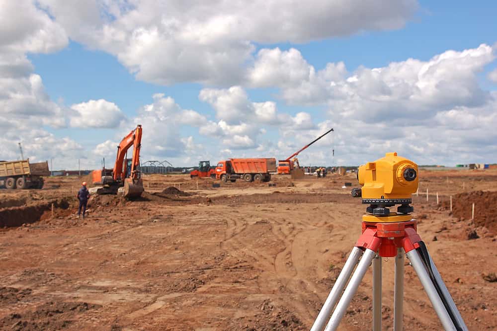 land-construction-trucks-dirt-lot